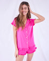 Raspberry pink bedshorts with frill hems and cuffs, short sleeves with white contrast piping details and patch pocket