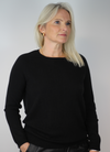  Designed to be a regular fit with long wide sleeves and a ribbed cuff, this super soft, black cashmere knit has the most beautiful key hole at the back. 