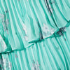Aqua midi dress with spaghetti straps and pleated triple tiered skirt with small cut out in the bodice