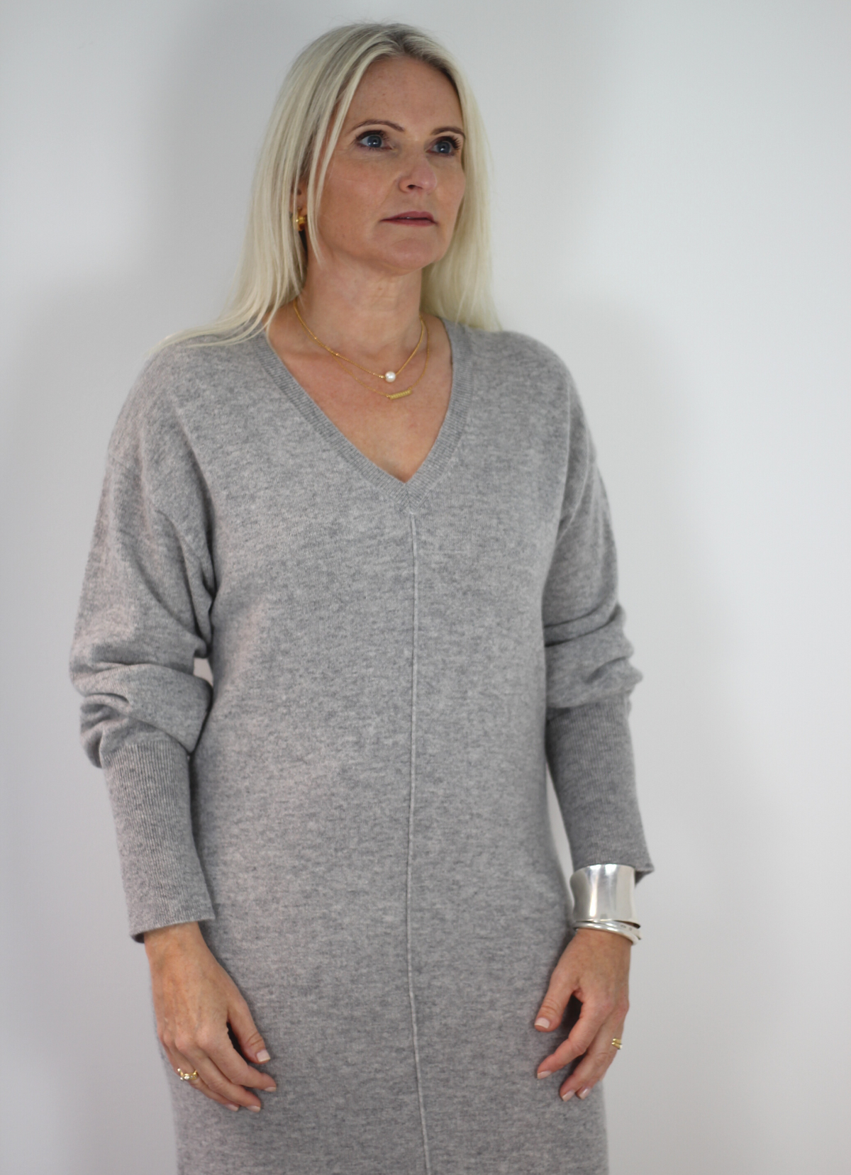 Light grey cashmere loose fitting midi dress with v neck, side splits and generous ribbed cuffs.