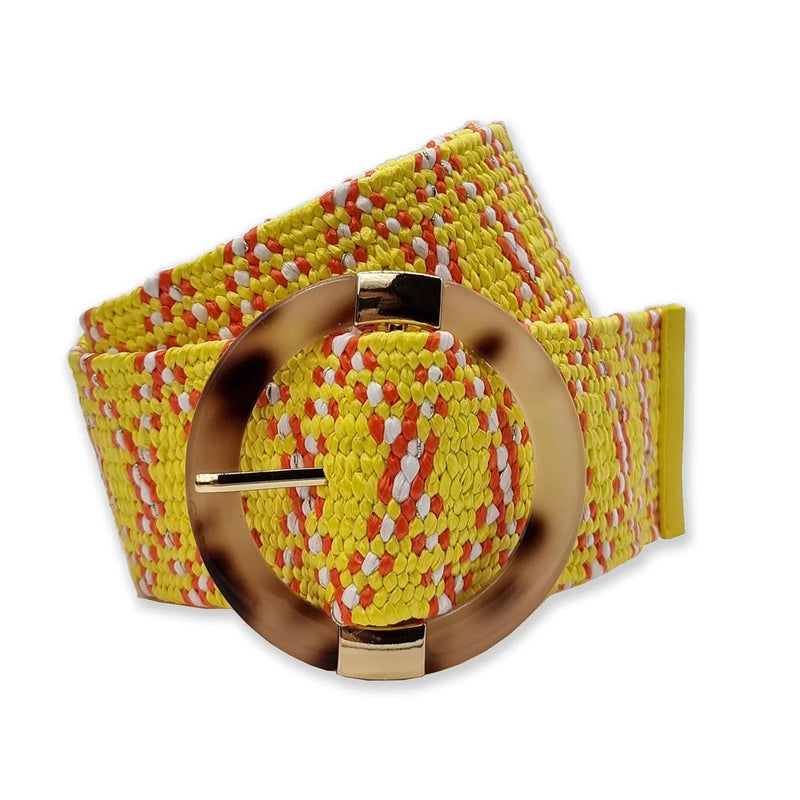 Yellow elasticated woven belt with orange and white pattern and circular resin buckle with gold trim
