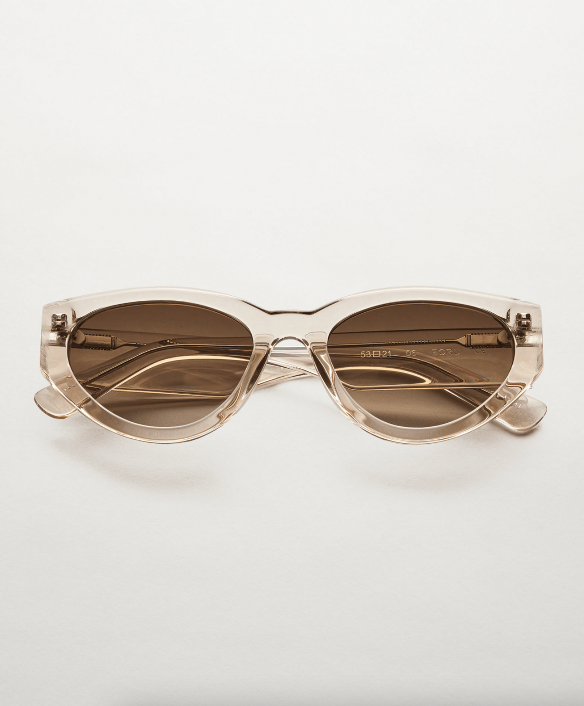 Ecru cats eye sunglasses with a brown lense