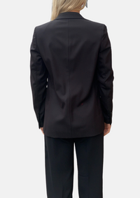 Black womans trouser suit with navy blue cami top
