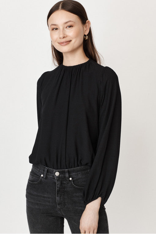 Black long sleeved blouse with elasticated cuffs hem and collar