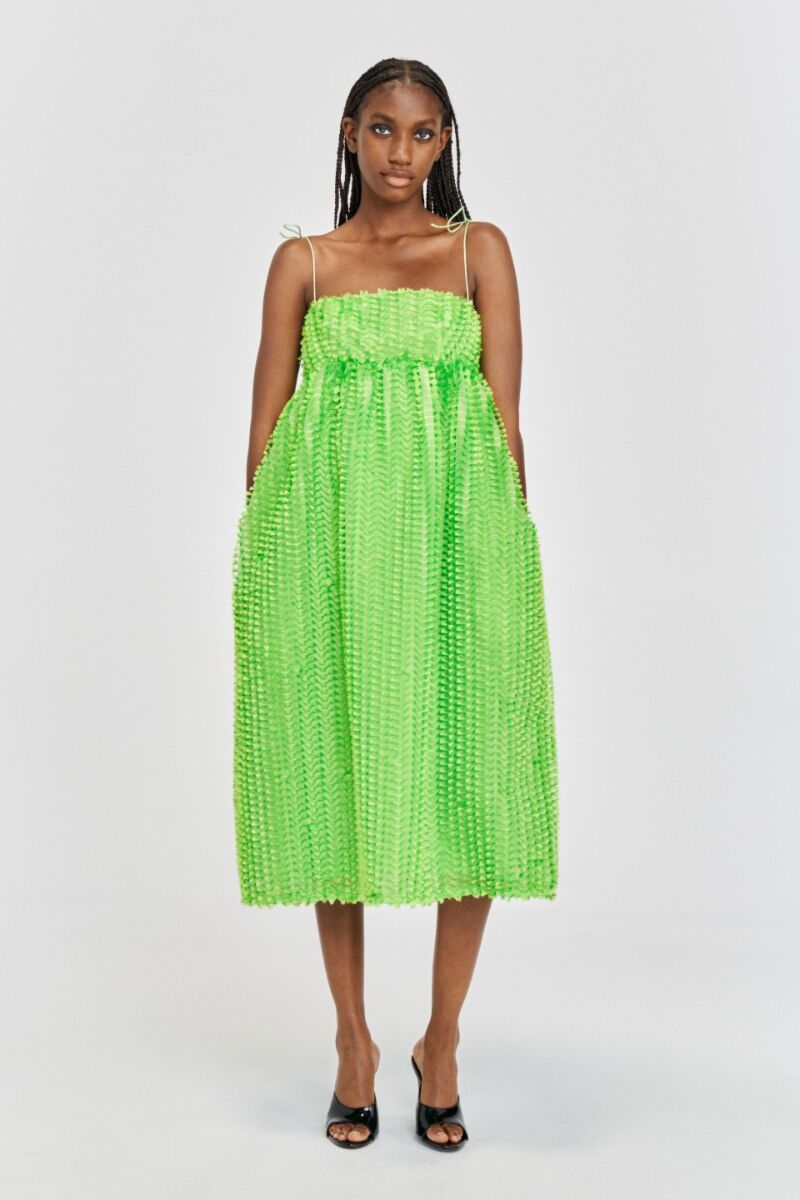 Acid green midi dress with spagetti straps a fitted bust and full empire line skirt with small tassles all over the fabric