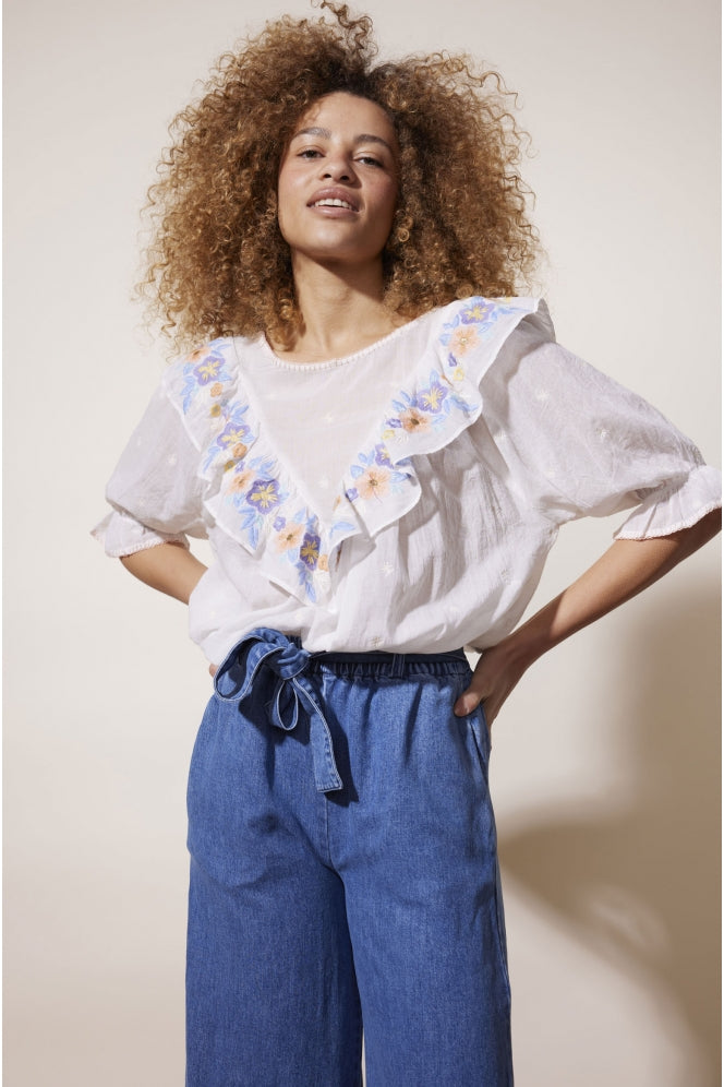 White embroidered oversize top with frill bib and pastel multi colour floral embroidery details