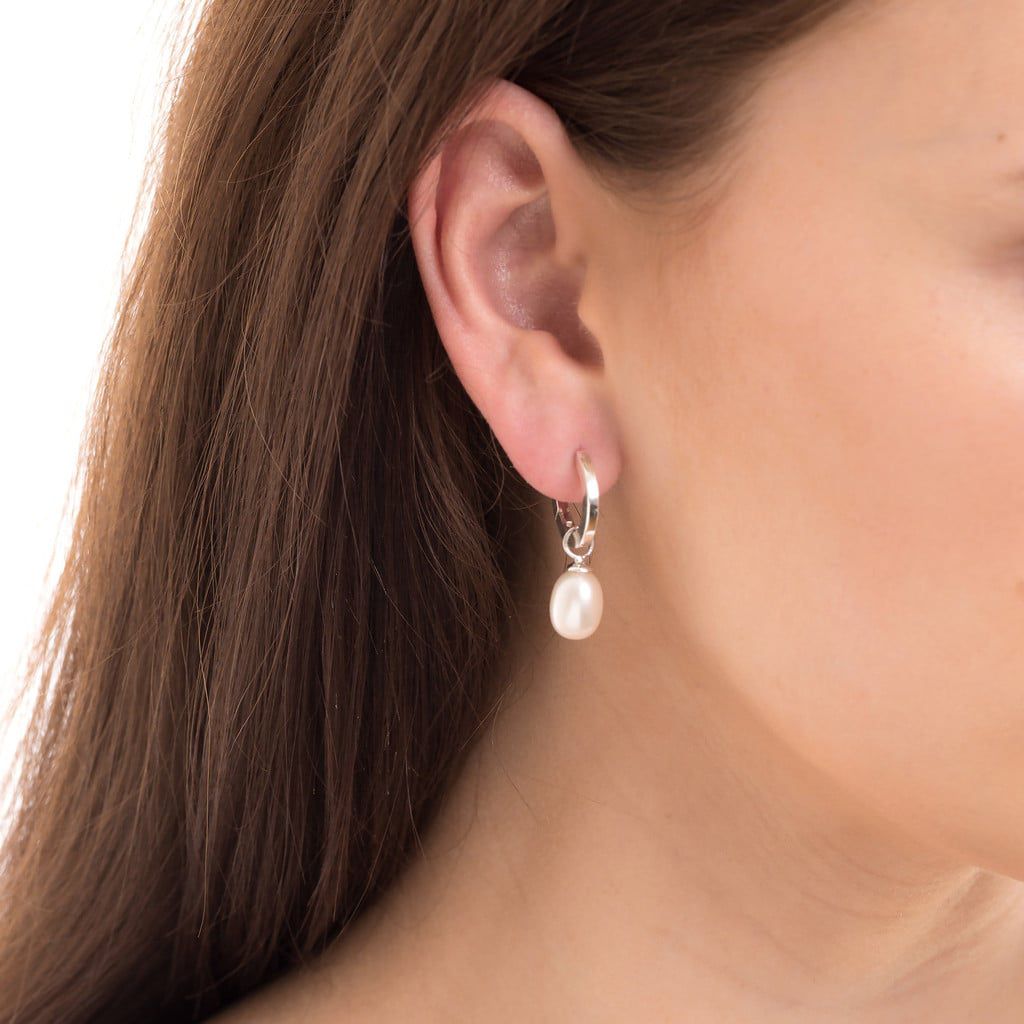 Chunky gold hoop earrings with pearl drop