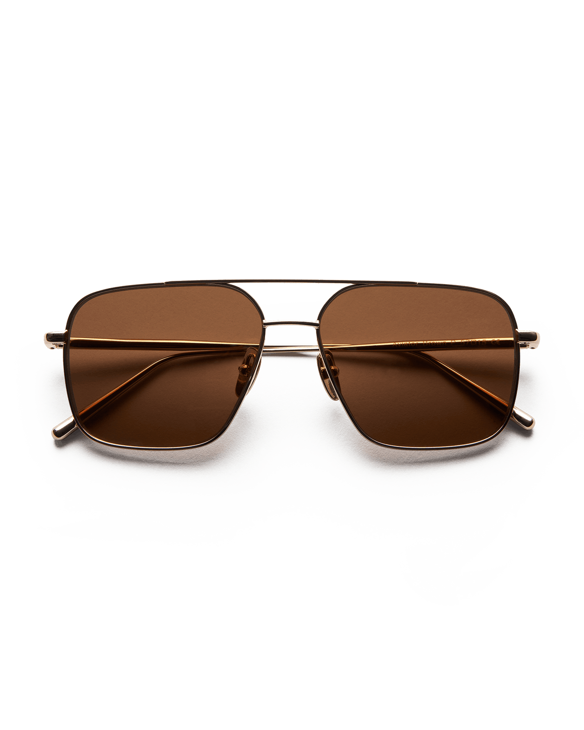 Soft gold coloured framed sunglasses with brown lenses
