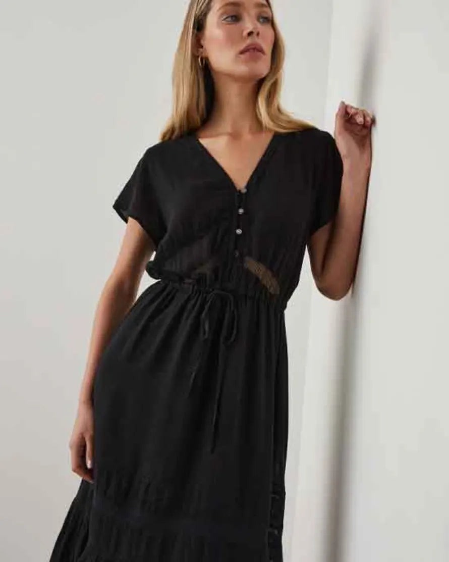 Black midi dress with V neckline frill skirt and lace and ladder inserts with short sleeves