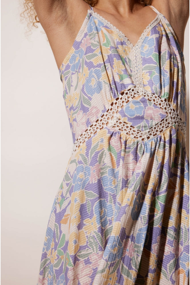 Strappy maxi dress in floral pastel print with macrame inserts in the body and hemline