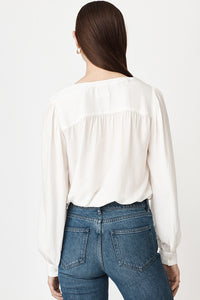 Notch neck long sleeved blouse in white with gathering at the shoulders
