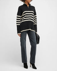 Black chunky jumper with white horizontal stripe turtleneck and quarter zip ribbed cuffs and hem