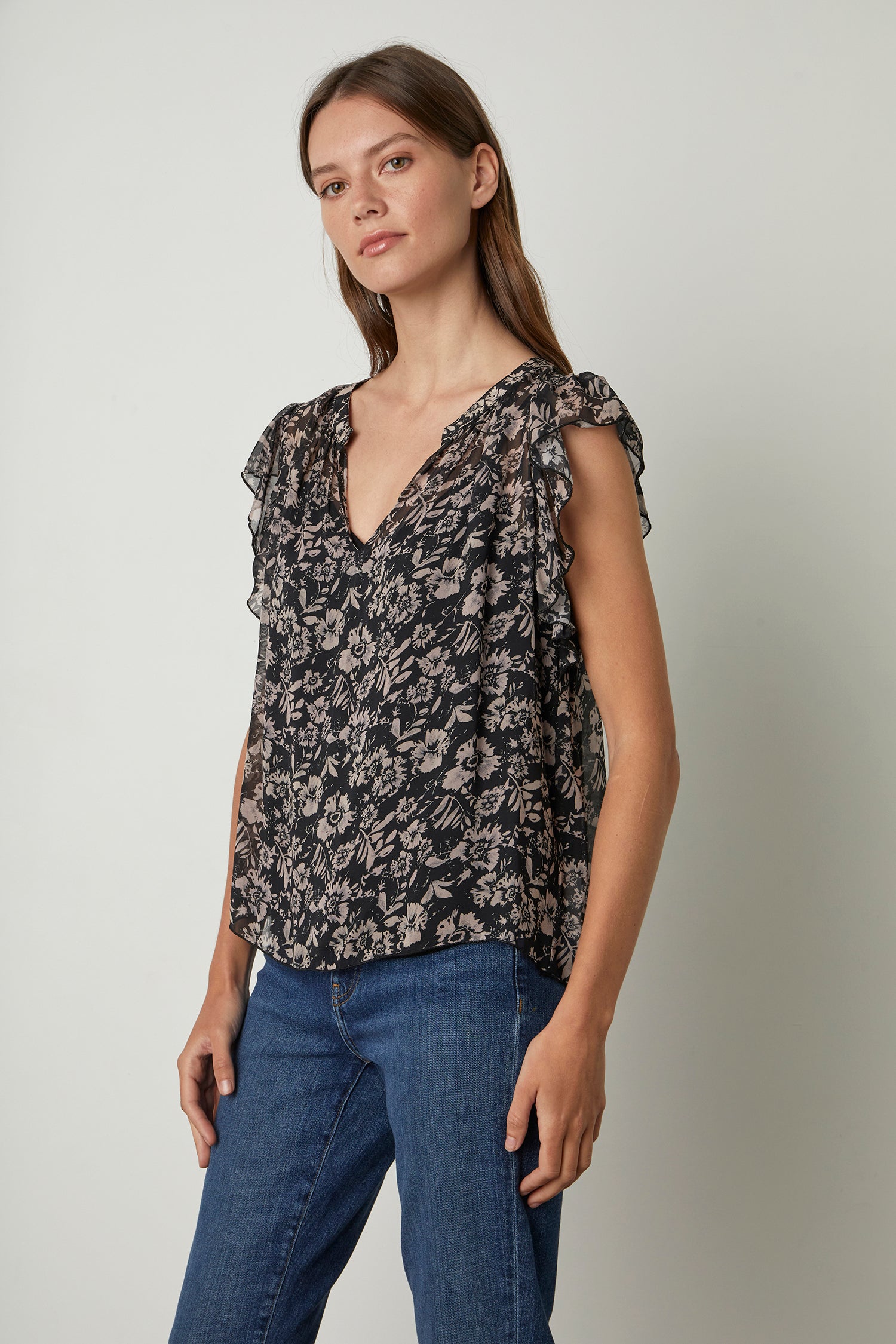 Black and blush floral print top with a flutter sleeve